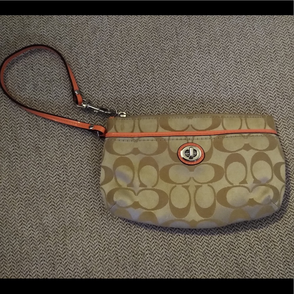 Authentic Coach wristlet, beige and orange. Mildly used.